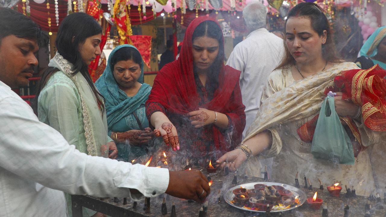 People performing rituals at Kali temple on the third day of Navratri festival, in Jammu, Wednesday, Sept. 24, 2025. Photo Courtesy: PTI